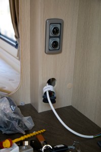 SPB_5D_095869 Installing an electric towel rail in a caravan - The feed for the towel rail is pulled through to an existing 13 amp socket