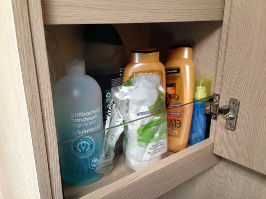 The lexan panel in place and the shelf restocked