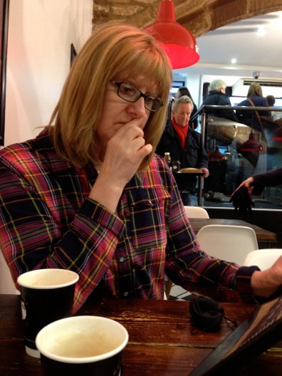 Sue just checking the menu to see if she missed anything!