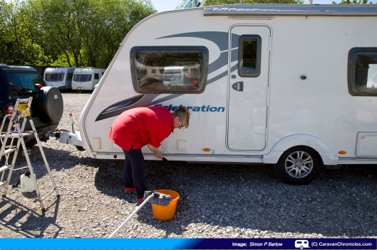 Sue giving the lower awning rail some attention!