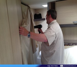 Sue's action shot of me drying the cover with the portable blast furnace!