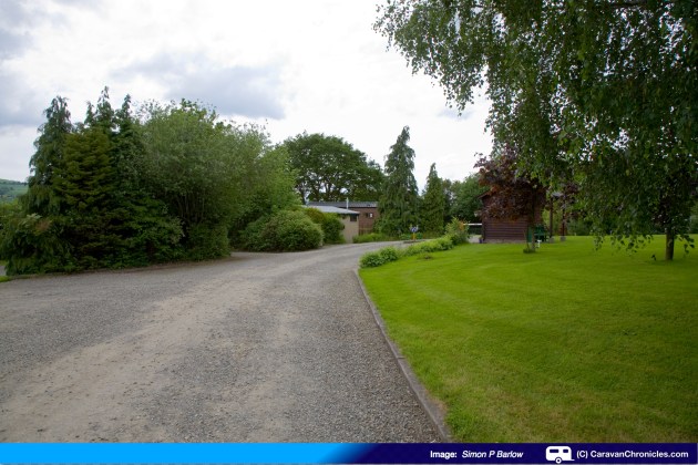 As you follow the drive round to the right, you approach the security barrier and reception...