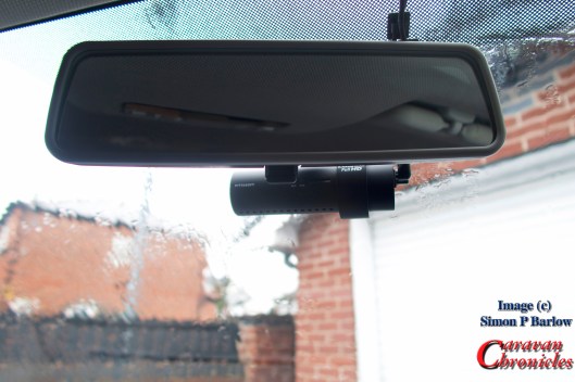 The front camera tucks up behind the rear view mirror